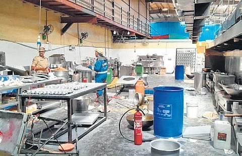 Police along with rescue team at the Karachi Bakery unit at Gaganpahad, the blast site, after a LPG cylinder exploded there on Thursday