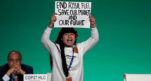 Licypriya Kangujam protests against the use of fossil fuels during an event at the COP28 U.N. Climate Summit, Monday, Dec. 11, 2023, in Dubai, United Arab Emirates. (AP)
