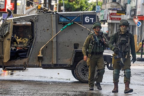 Israeli soldiers patrol on December 13, 2023 following an overnight army raid in Jenin in the occupied West Bank, as battles continue between Israel and the militant movement Hamas. (Photo | AFP)