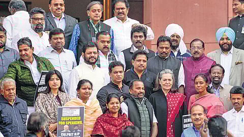 Congress leader Sonia Gandhi with suspended MPs during the winter session of Parliament in New Delhi.