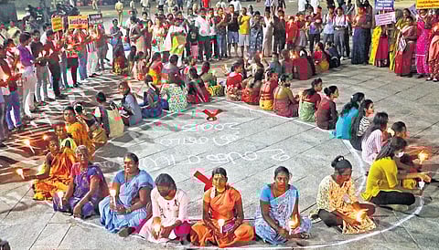 SCOHD members hold a candle light vigil on World AIDS Day 2023 in Puducherry | sriram r