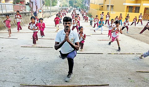 V Praveen Kumar with his students.