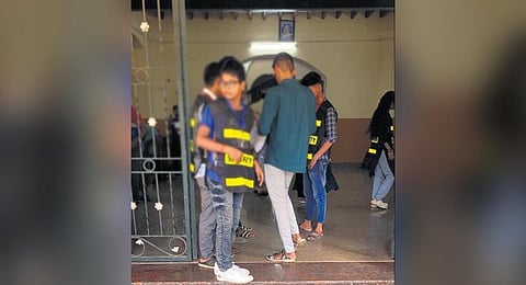 Students, including a minor, frisking candidates appearing for the exam | Express