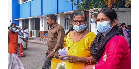Visitors wear masks at the Ernakulam Government Hospital after rise in number of COVID cases, in Kochi. (Photo | PTI)