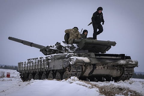 FILE - Ukrainian soldiers practice on a tank during military training, in Ukraine, Wednesday, Dec. 6, 2023. (AP Photo)
