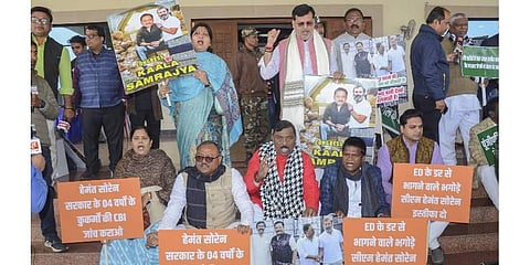BJP MLAs stage a protest against Congress MP Dhiraj Prasad Sahu during the Winter session of the Jharkhand Assembly, in Ranchi. (Photo | PTI)