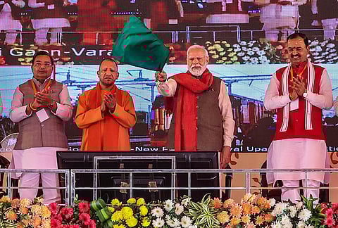 Prime Minister Narendra Modi with UP CM Yogi Adityanath during the foundation stone laying and inauguration of various projects in Varanasi (Photo | PTI)