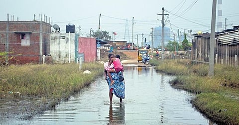 It’s been 13 days since the rain and still Athipattu Pudunagar residents have to wade through knee deep water | Express