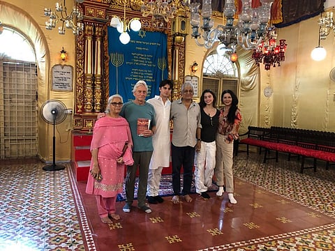 Eliyas Josephai with Michael Douglas, Catherine Zeta-Jones, Dylan Douglas and Cary Zeta Douglas inside Broadway Synagogue in Kochi