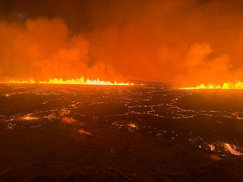 Billowing smoke and flowing lava turning the sky orange are seen in this Icelandic Coast Guard handout image during a volcanic eruption in western Iceland (Photo | AFP)