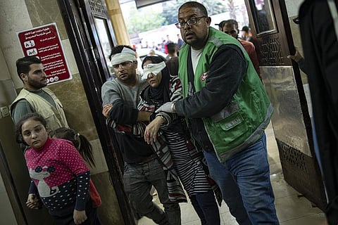 Palestinians wounded in Israeli bombardment of the Gaza Strip are brought to a hospital in Khan Younis, Friday, Dec. 1, 2023. (Photo | AP)