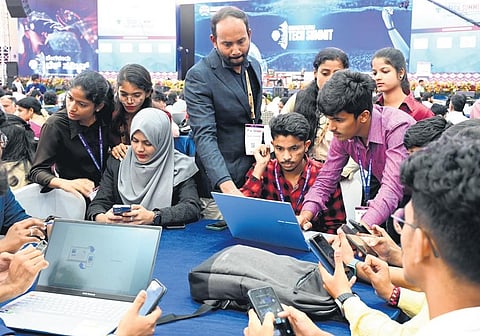 Students busy completing their task at the Bengaluru Tech Summit venue o the third day of the summit.