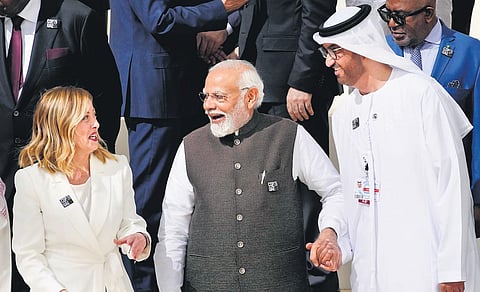 Prime Minister Narendra Modi with COP28 President Sultan al-Jaber and Italy’s Prime Minister Giorgia Meloni at the UN climate summit in Dubai on Friday | AP