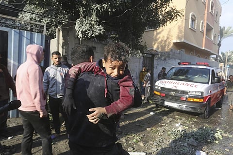 Palestinians evacuate wounded in Israeli bombardment, Friday, Dec 1, 2023. (Photo | AP)