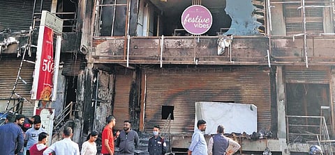 A fire force personnel suffered minor injuries while putting off the fire in the three-storeyed building in Marathahalli on Monday night | Allen Egenuse J
