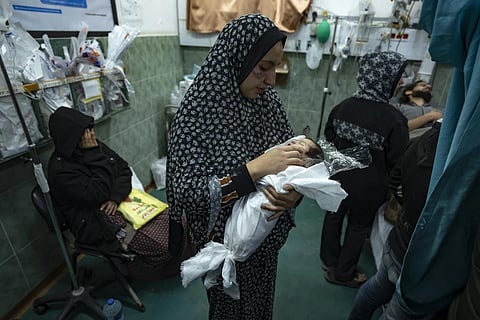 Palestinians mourn their relatives killed in the Israeli bombardment of the Gaza Strip, at the Hospital Rafah, Dec 19, 2023. (Photo | AP)