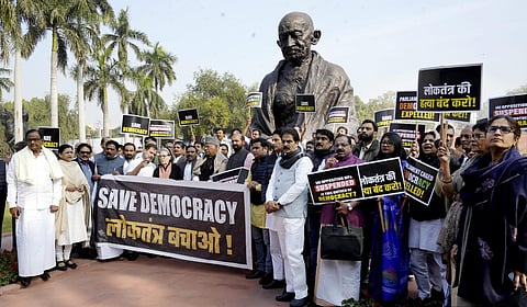 Congress President Mallikarjun Kharge with party leaders Sonia Gandhi and Rahul Gandhi and other opposition leaders during a protest over the suspension of MPs from both houses. (Photo | PTI)