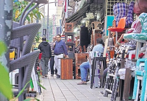 Navigating through a maze of furnishings on a footpath challenges even the most patient pedestrian at Central street, Shivajinagar | Allen Egenuse J