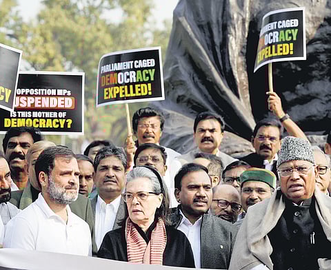 Congress MPs Rahul Gandhi, Sonia Gandhi and Mallikarjun Kharge with opposition leaders during a protest over the suspension of MPs in Parliament | pti