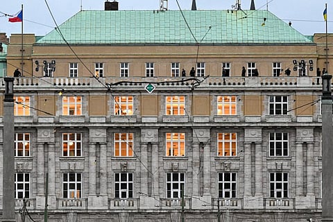 Armed police are seen on the balcony of the Charles University in central Prague. (Photo | AFP)