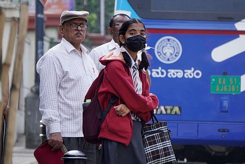 A schoolgirl wears a mask amidst rising Covid cases across the state, in Bengaluru on Thursday. (Photo | Allen Egenuse J)