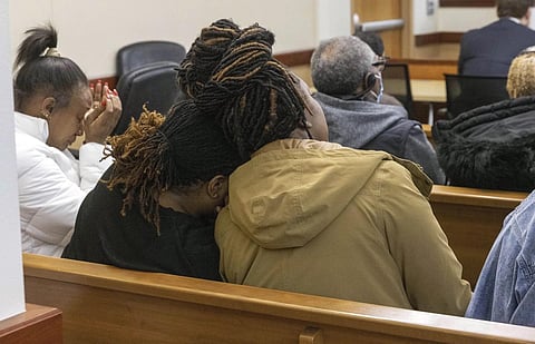 Members of Manny Ellis' family react as Pierce County judge reads the verdict, Dec 21, 2023. (Photo | AP)