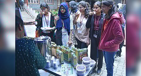 Students try out ragi malt at the ‘Millets In My Plate’ event at Mount Carmel College ahead of an international conference on millets, in Bengaluru on Thursday | Express