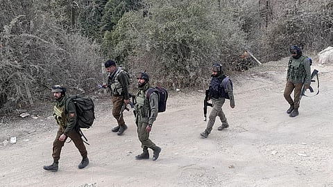 Army personnel stand guard near the site where two Army vehicles were ambushed by terrorists on Thursday, in Poonch district, Friday, Dec. 22, 2023. (PTI)