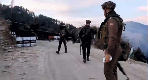 Army personnel stand guard near the site where an Army vehicle was ambushed by terrorists, in Poonch district, Thursday, Dec. 21, 2023. (PTI)
