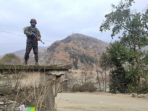 An Army personnel during a cordon and search operation after the recent ambush on two Army vehicles that left five soldiers dead, in Poonch district, Saturday, Dec. 23, 2023. (Photo | PTI)