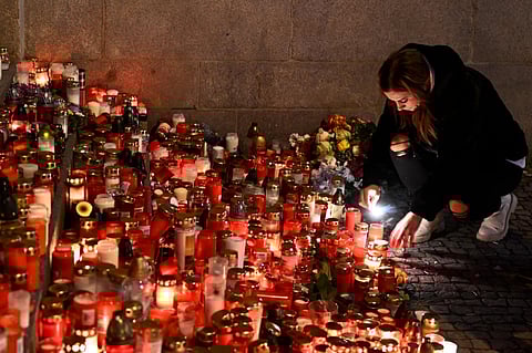 Mourners bring flowers and candles outside the building of Philosophical Faculty of Charles University in downtown Prague, Czech Republic on Saturday, December 23, 2023. (Photo | AP)