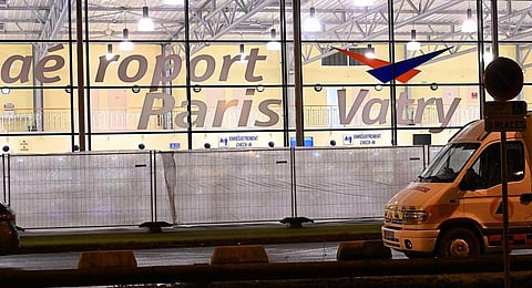 A civil protection vehicle parked outside the Vatry airport, where a plane carrying 303 Indian passengers is grounded on the tarmac since December 21, due to 'suspicions of human trafficking'. (AFP)