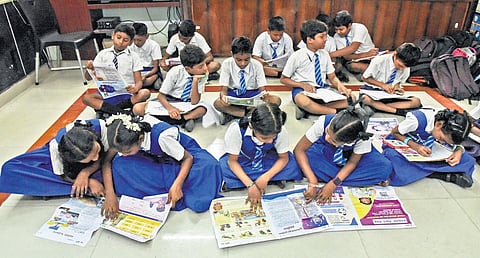 Government school students scan through copies of the magazines | Express