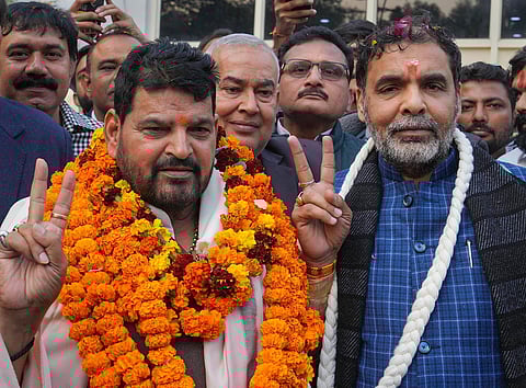 BJP MP Brij Bhushan Sharan Singh with president of the Wrestling Federation of India (WFI) Sanjay Singh. (File photo | PTI)