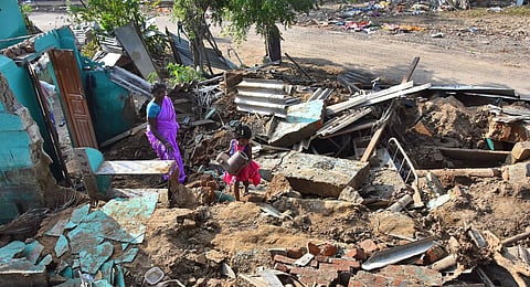 A family searches through the rubble of their house at Authoor in Thoothukudi. (Photo | V Karthikalagu, EPS)
