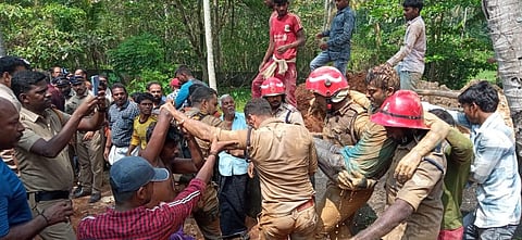 Vinayan, a native of Ayirooppara near Pothencode and Deepak, a native of Bihar were the two worker who were rescued after being tarpped under soil. (Photo | PTI)