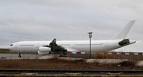 This photograph taken on December 23, 2023, shows the Airbus A340 which was grounded over suspected 'human trafficking' at Vatry airport, north-eastern France. (AFP)