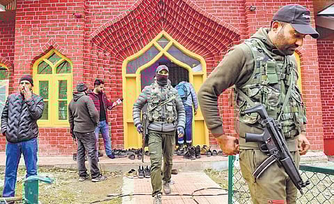 Security personnel gather at the mosque where the retired senior superintendent of police was killed in Baramulla on Sunday | ANI