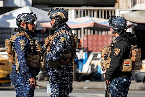 Iraqi security forces' are stationed by the Freedom Monument in Baghdad's Tahrir Square on December 26, 2023. (Photo | AFP)