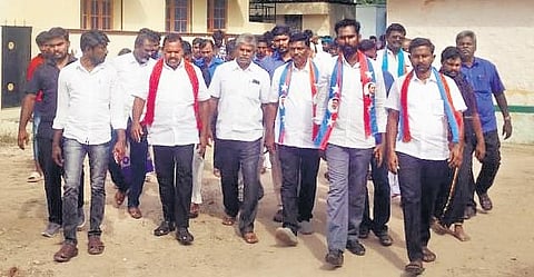 Dalits walking with slippers on Kambala Naicken Street in Rajavur village on Sunday
