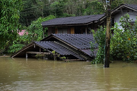 A house is seen submerged in floodwaters following heavy rain in Thailand's southern province of Narathiwat on December 25, 2023. (Photo | AFP)