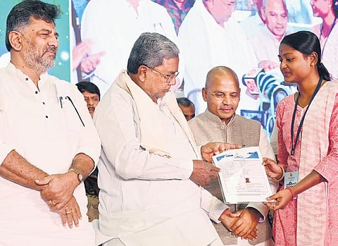 Chief Minister Siddaramaiah, DK Shivakumar and Minister Dr Sharan Prakash Patil during the launch of the Yuva Nidhi scheme in Bengaluru on Tuesday. (Photo | Express)