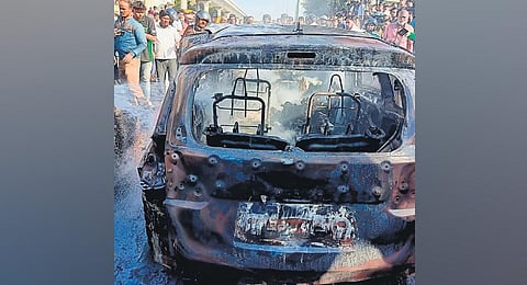 The charred remains of the MUV which caught fire in Anchepalya on Bengaluru- Tumakuru road, in Bengaluru on Tuesday. (Photo | Express)