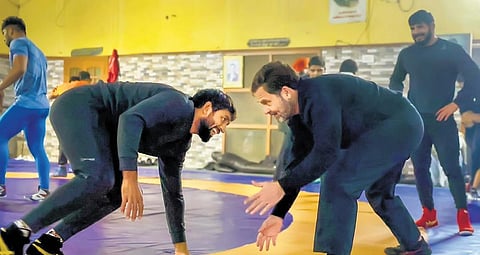 Rahul Gandhi with wrestler Bajrang Punia at Chhara, in Jhajjar on Wednesday | pti