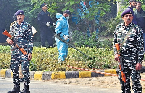 National Security Guard forensics team inspects an area behind the Israel embassy in New Delhi on Wednesday, after a low-intensity blast on Tuesday | parveen negi