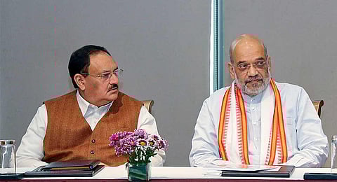 Union Home Minister Amit Shah with BJP National President JP Nadda and West Bengal BJP President Sukanta Majumdar during a party meeting, in Kolkata, Tuesday, Dec. 26, 2023. (PTI)