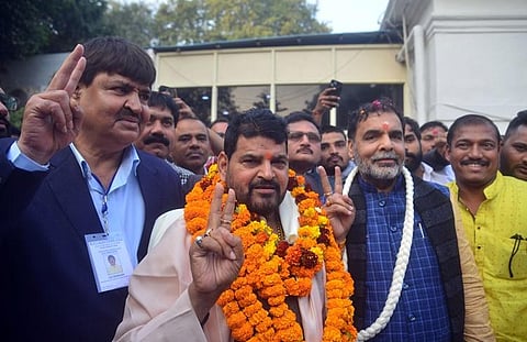 Sanjay Singh with Brij Bhushan Sharan Singh (L) after winning election for WFI president's post. (Photo | Parveen Negi)