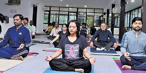 Mayor Gadwal Vijayalaxmi and GHMC commissioner D Ronald Rose take part in a meditation session on Wednesday