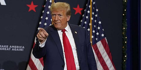 Former President Donald Trump greets supporters as he arrives at a commit to caucus rally, Tuesday, Dec. 19, 2023, in Waterloo, Iowa. (Photo | AP)