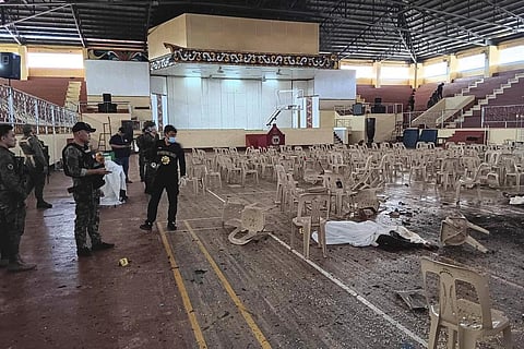In this handout provided by the Provincial Government of Lanao Del Sur - Public Information Office, law enforcers conduct an investigation at the explosion site in Marawi city | AP